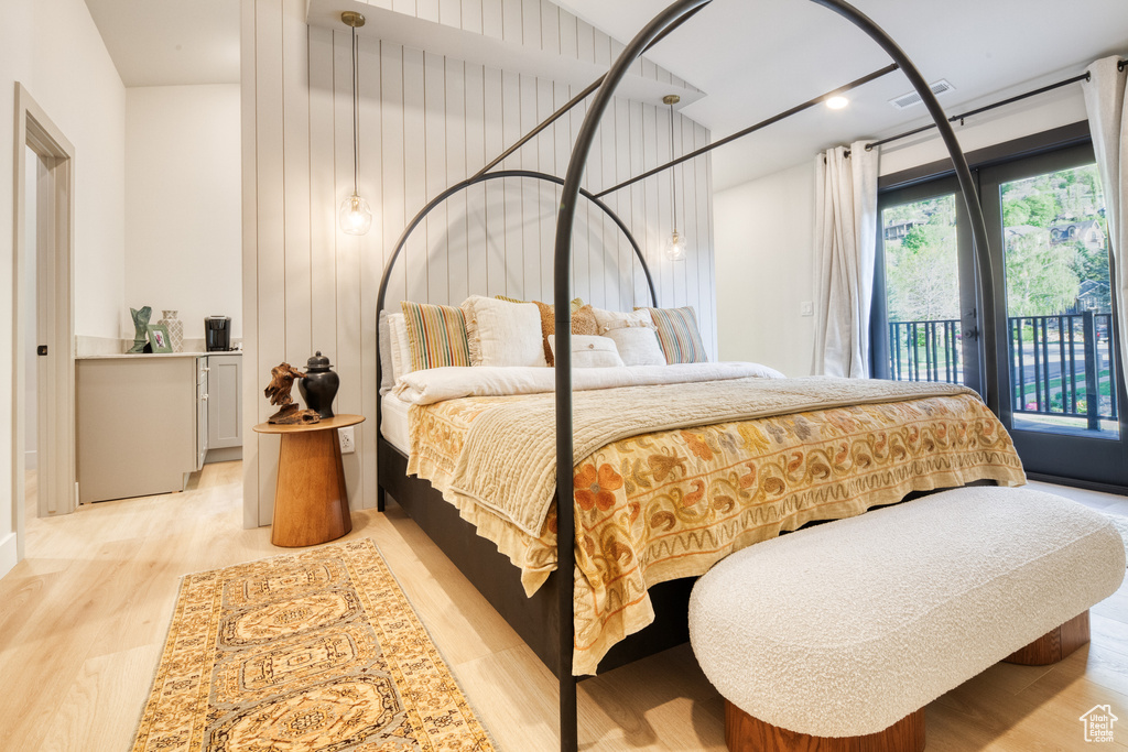 Bedroom with access to outside and light wood finished floors
