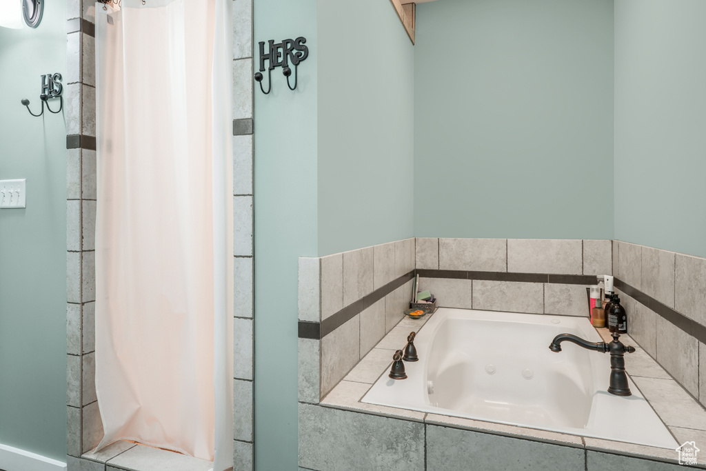 Full bath with a whirlpool tub