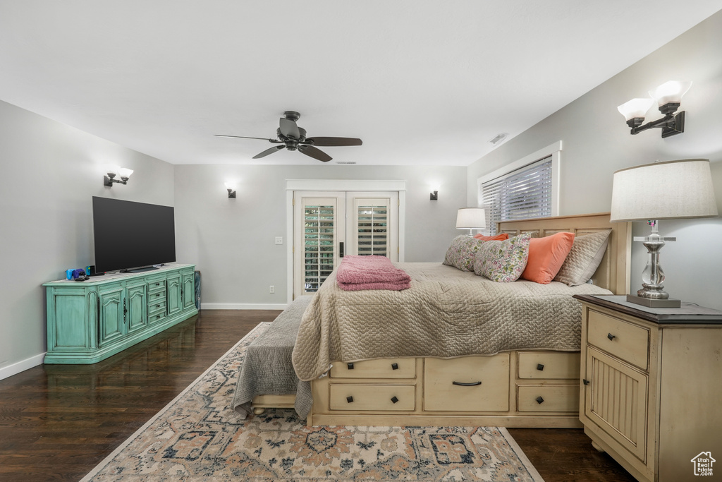 Bedroom with baseboards, access to outside, a ceiling fan, and dark wood-type flooring
