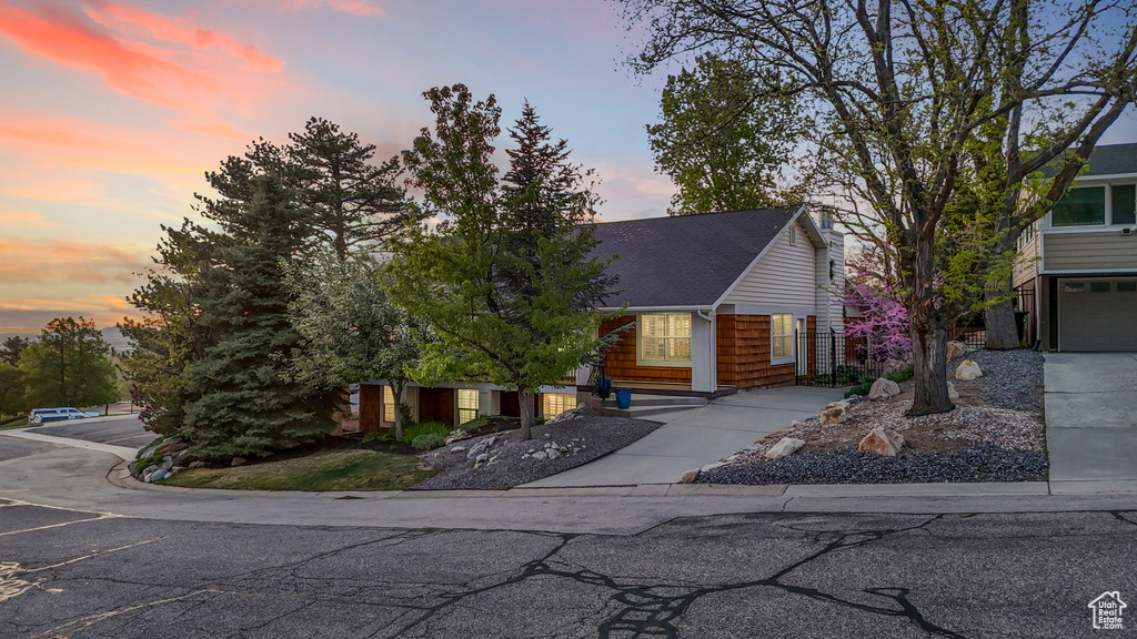 View of front of house featuring a shingled roof