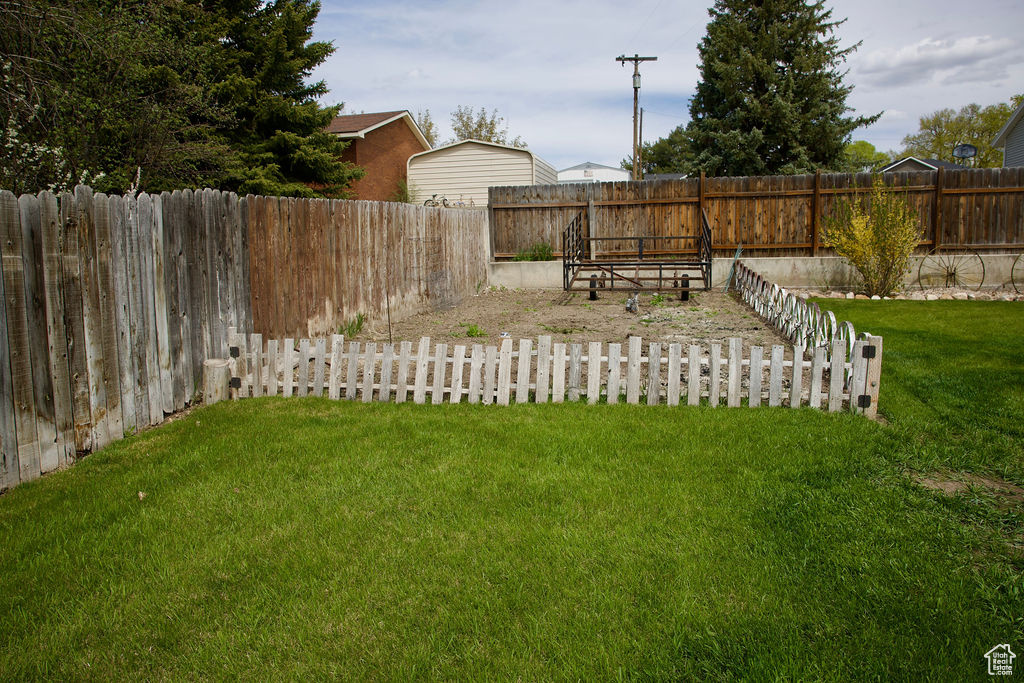 View of yard with a fenced backyard