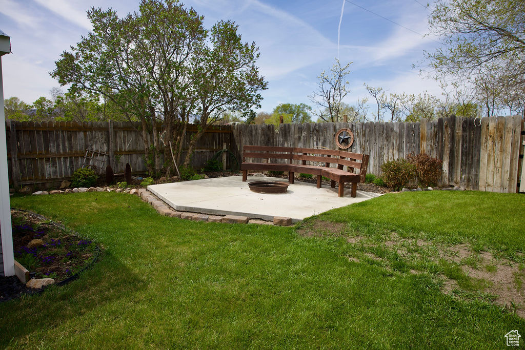 View of yard featuring a patio and a fenced backyard