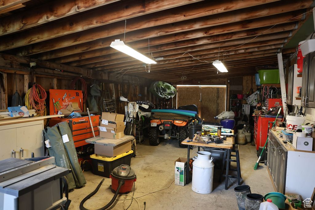 Basement featuring a workshop area and a garage