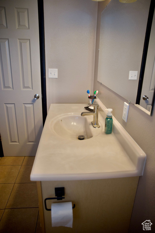 Bathroom featuring vanity and tile patterned flooring