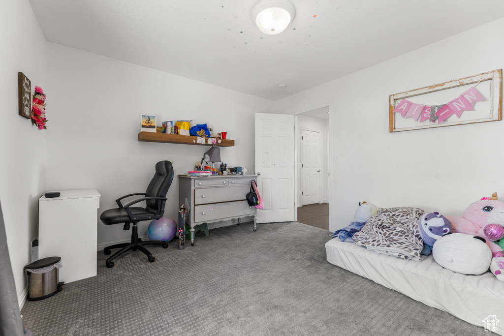 Bedroom with baseboards and carpet flooring