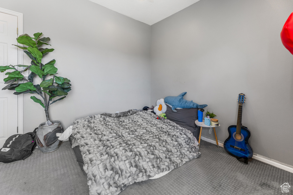 Carpeted bedroom with baseboards