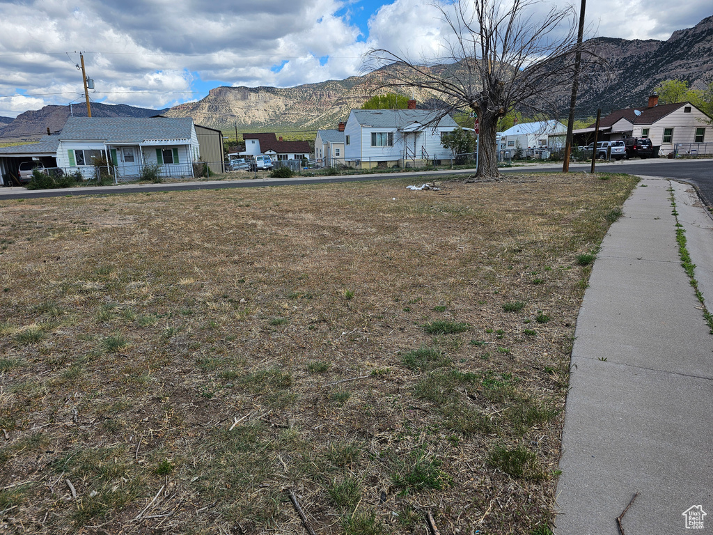 Single story home with a mountain view and a residential view
