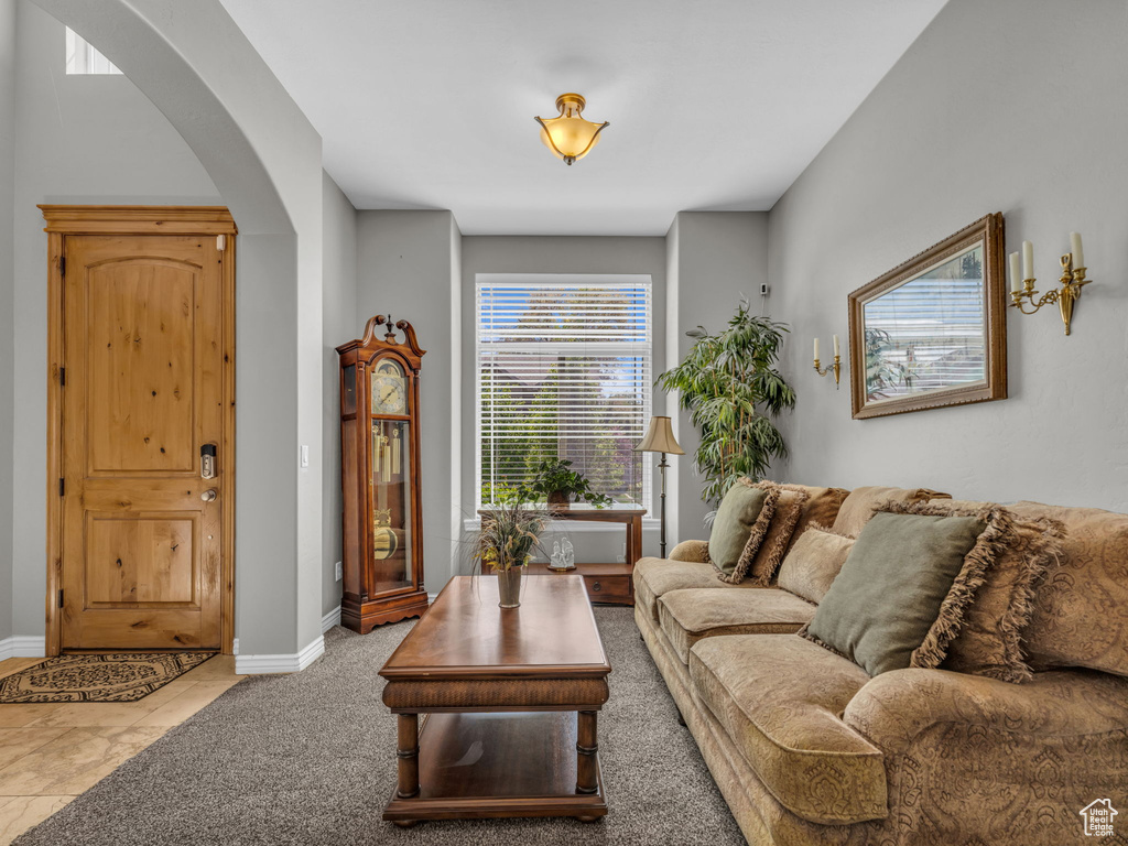 Living room with arched walkways and baseboards