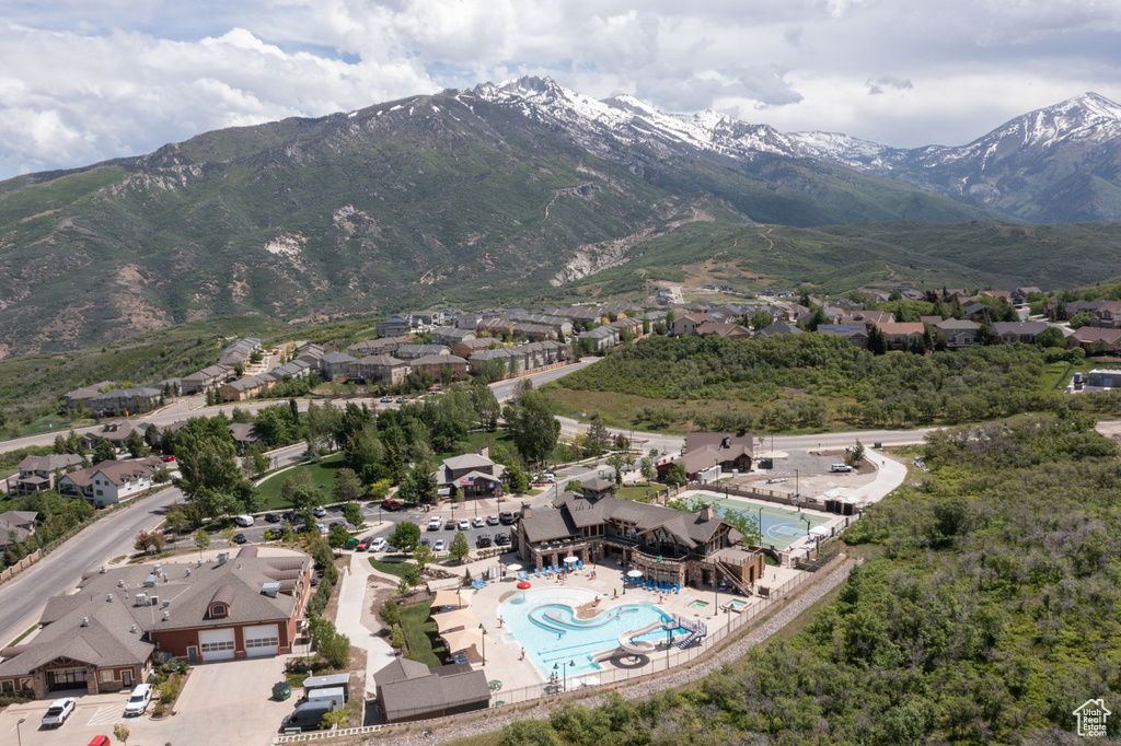 Birds eye view of property with a residential view and a mountain view