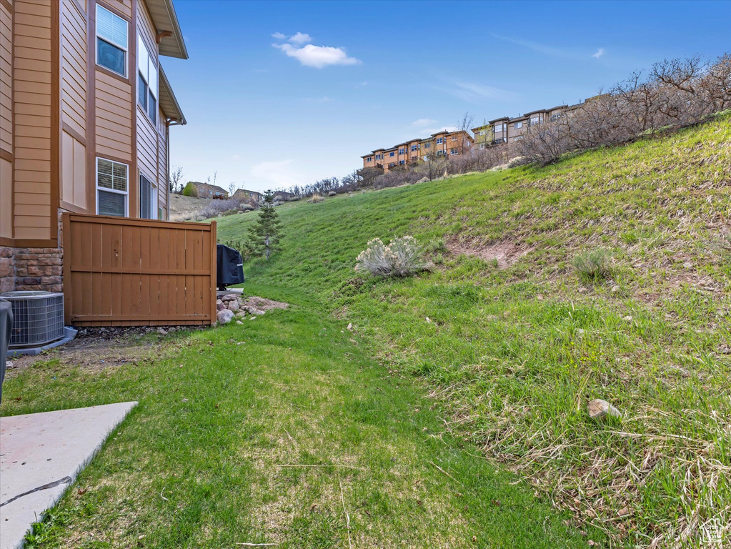 View of yard featuring central AC unit