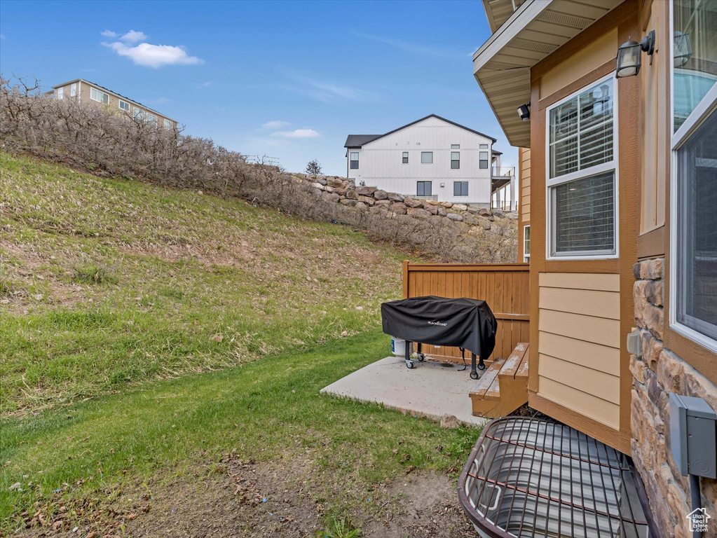 View of yard with a patio