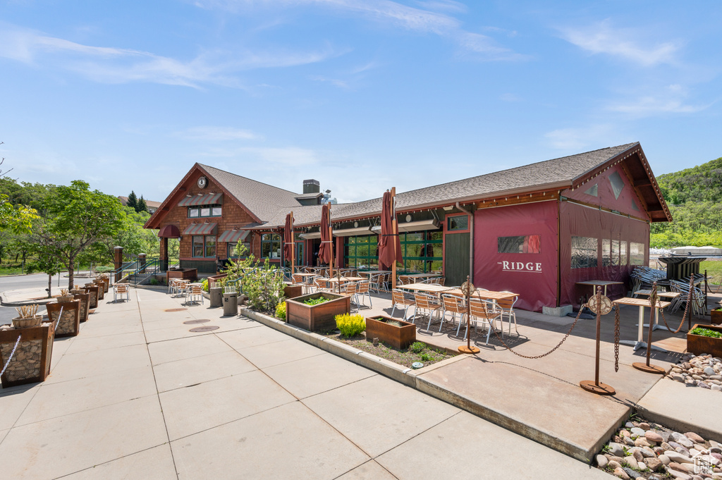 View of home\'s community with a patio area