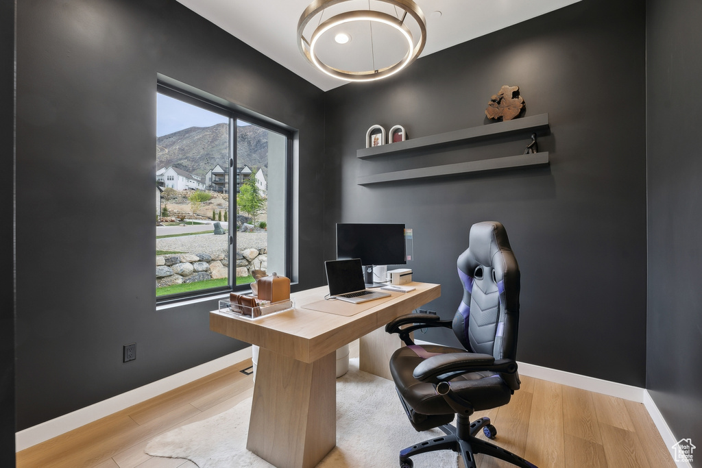Office with baseboards and wood finished floors