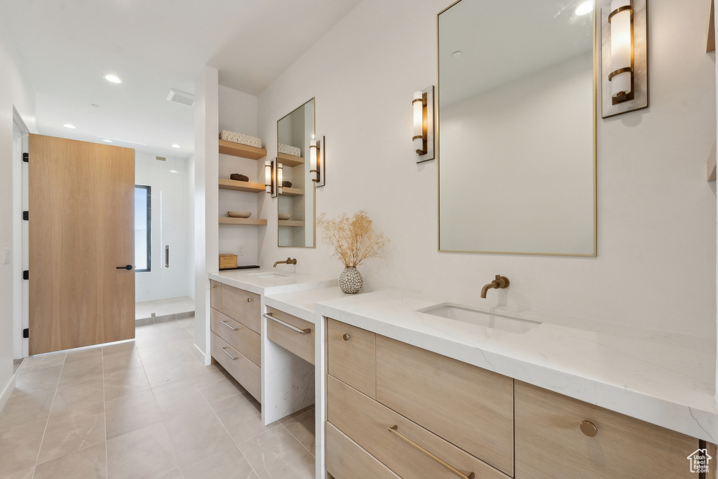 Bathroom with recessed lighting, a sink, two vanities, and visible vents