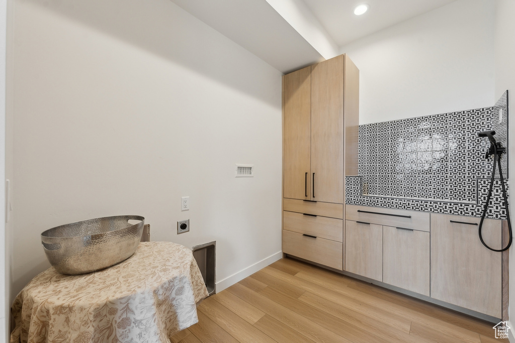 Kitchen featuring recessed lighting, light wood finished floors, baseboards, and light brown cabinets
