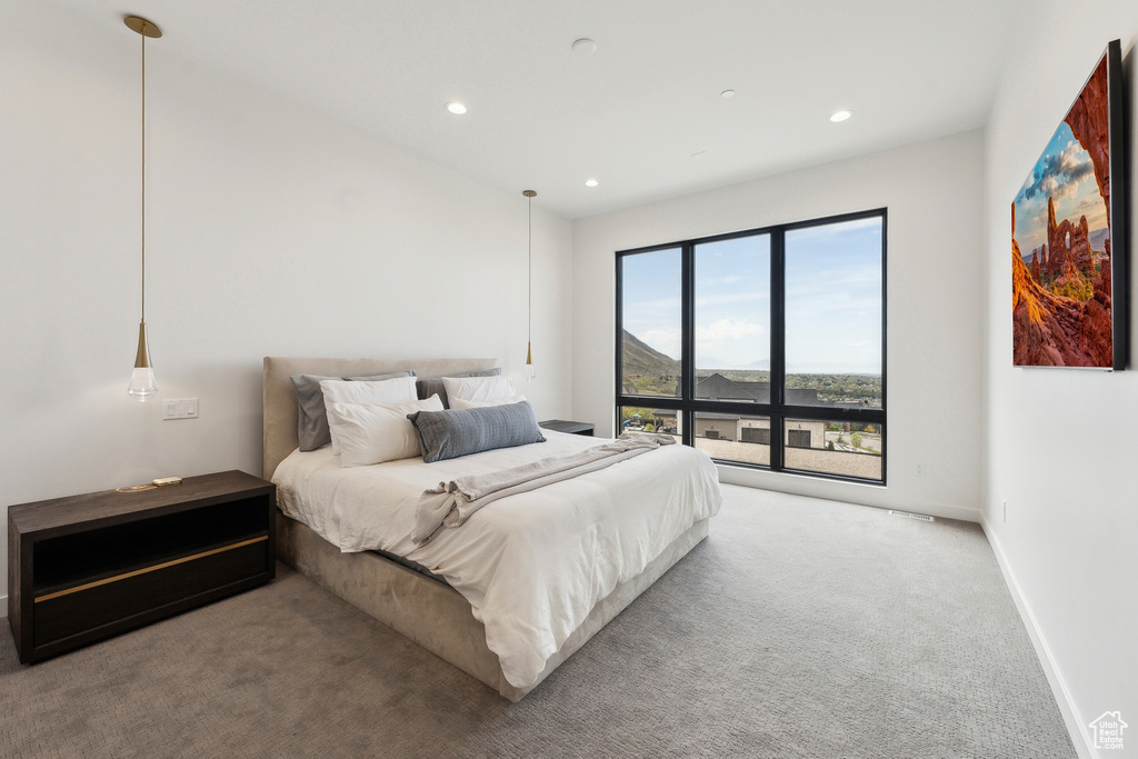 Carpeted bedroom featuring recessed lighting and baseboards