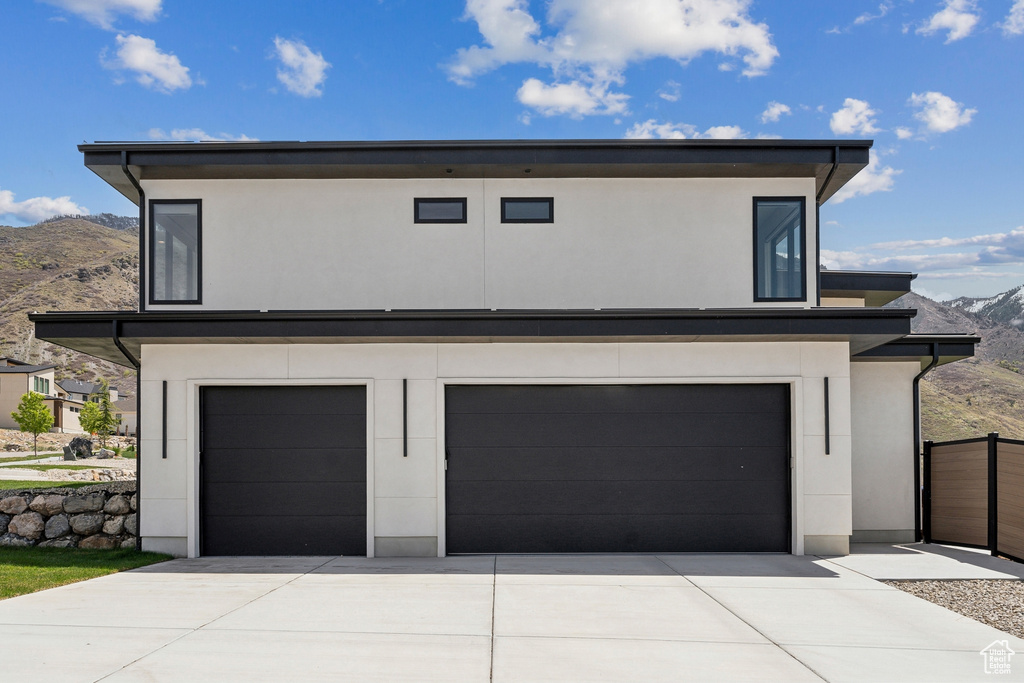 Exterior space with a mountain view and driveway