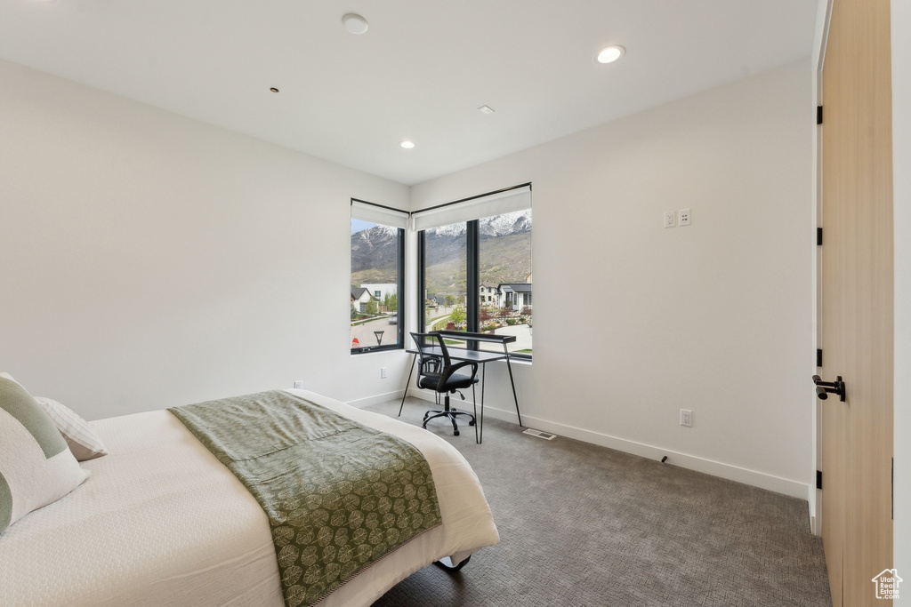 Bedroom with carpet floors, recessed lighting, baseboards, and a mountain view