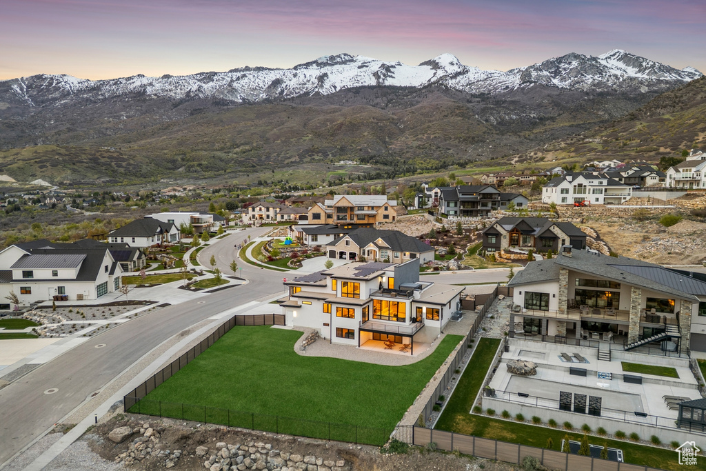 Drone / aerial view with a residential view and a mountain view