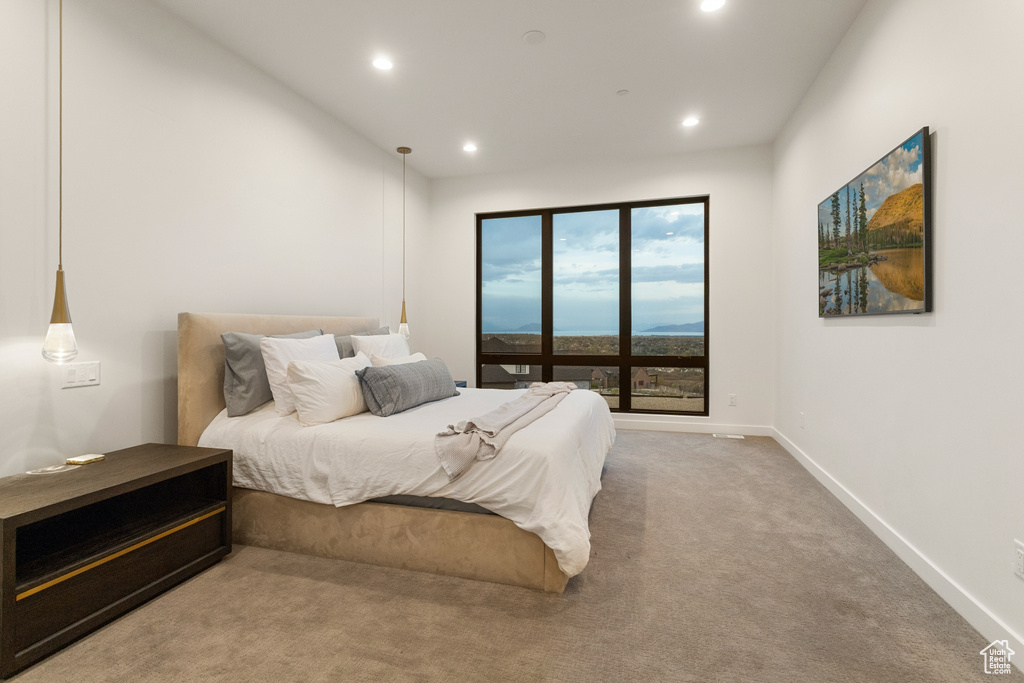 Carpeted bedroom featuring recessed lighting and baseboards