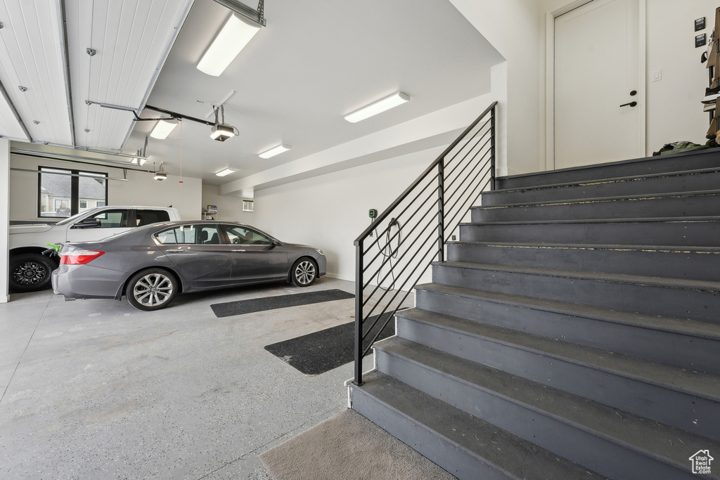 Staircase featuring speckled floor