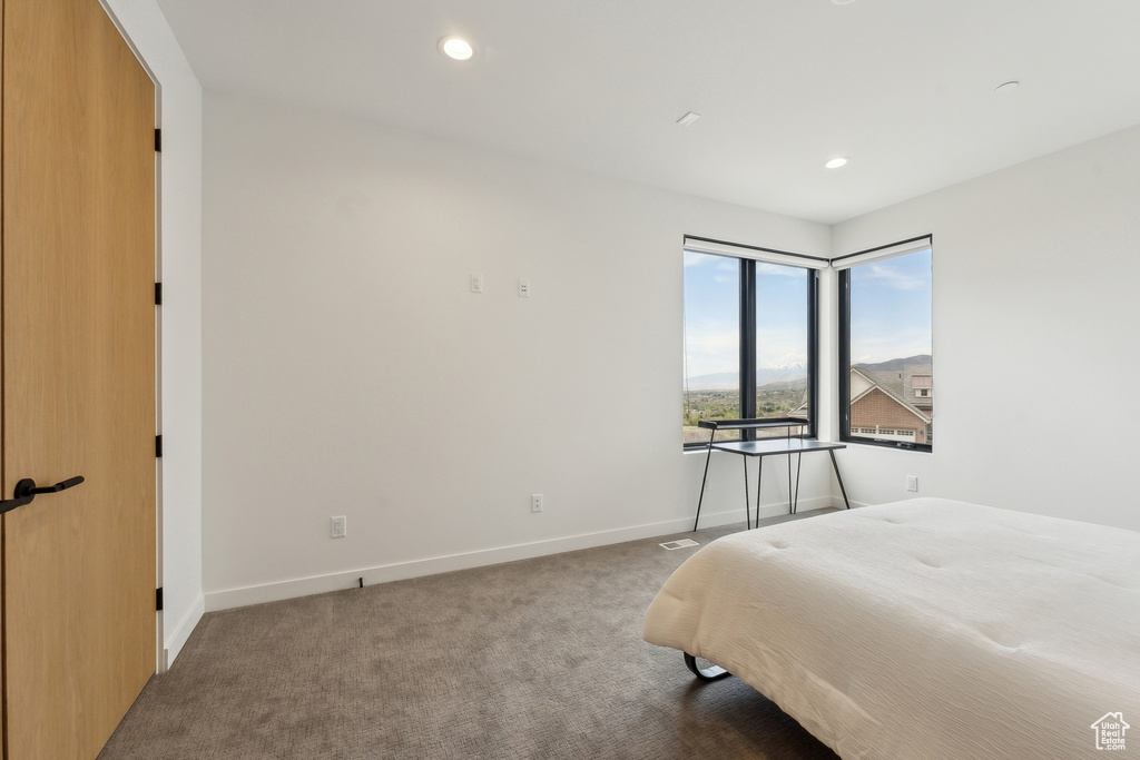 Bedroom featuring baseboards, carpet, and recessed lighting