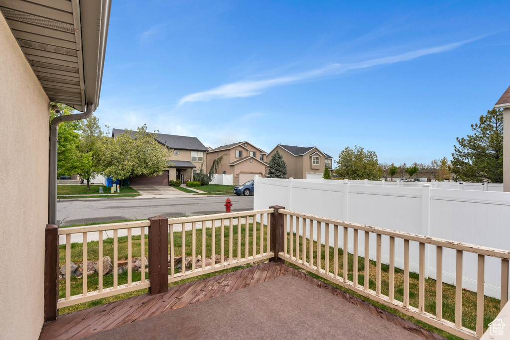 View of patio / terrace featuring fence and a residential view