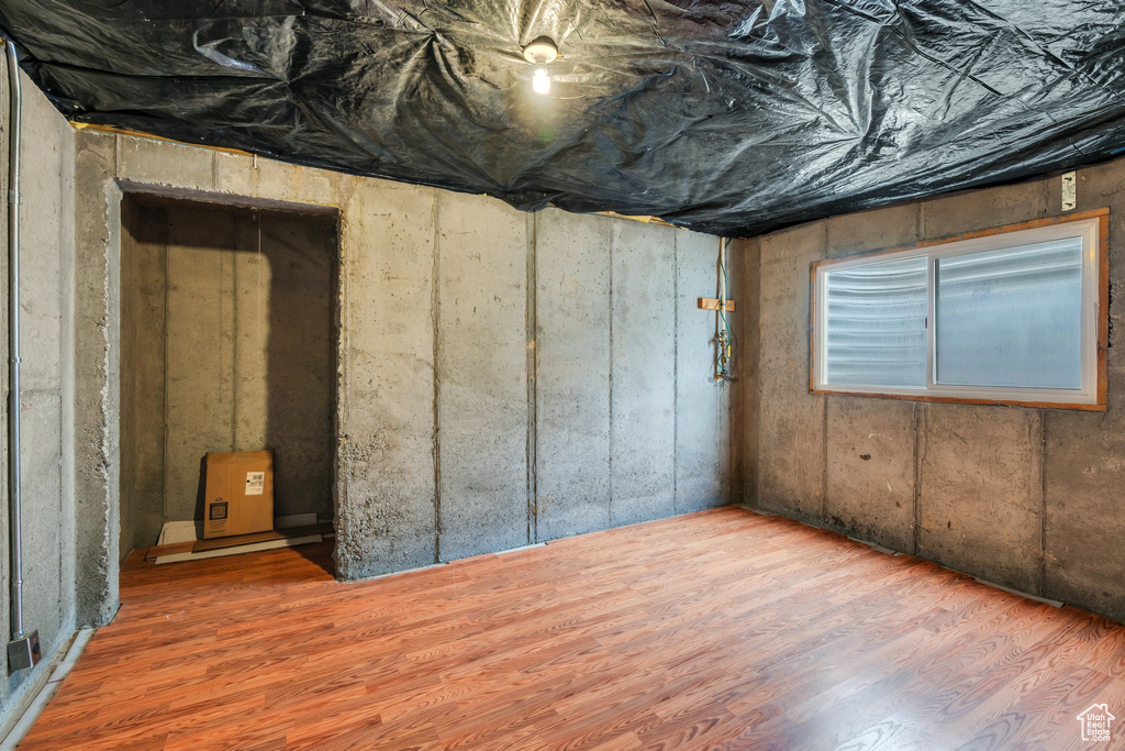 Below grade area featuring wood finished floors