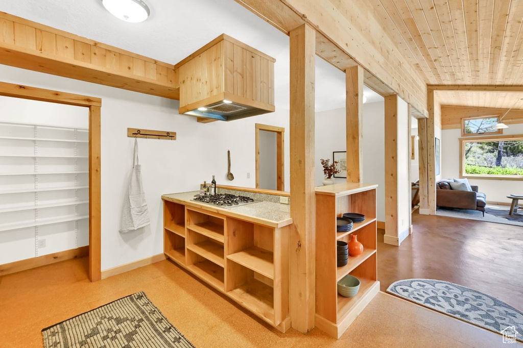 Kitchen featuring wood ceiling, open shelves, light countertops, baseboards, and white gas cooktop