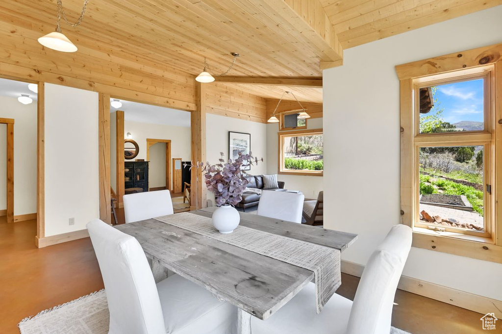Dining space featuring baseboards and wooden ceiling