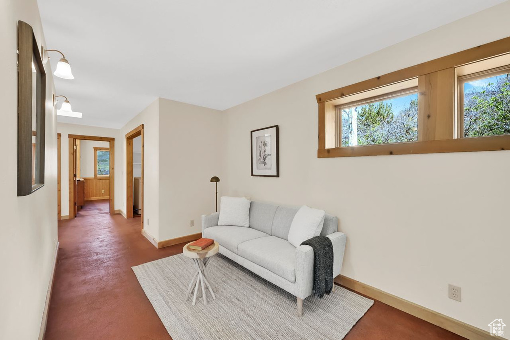 Carpeted living room with baseboards