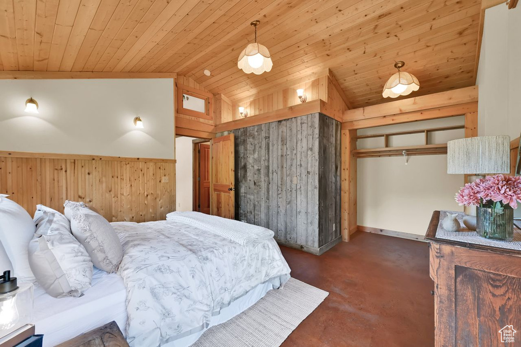 Bedroom featuring wood ceiling, wood walls, and lofted ceiling