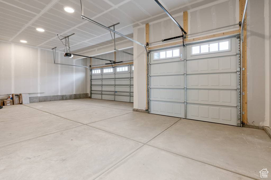 Garage with recessed lighting and a garage door opener