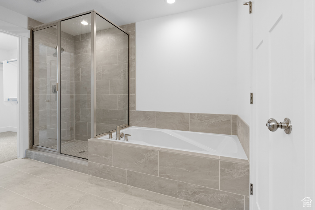 Full bath with a garden tub, recessed lighting, a stall shower, and tile patterned flooring