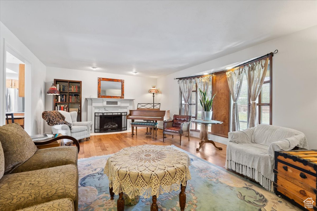 Living room featuring a fireplace and wood finished floors