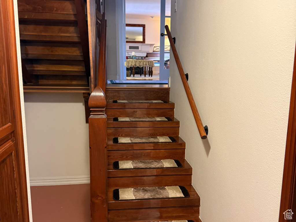Stairway featuring baseboards
