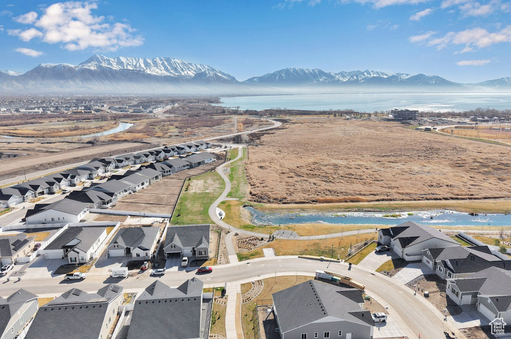 Drone / aerial view featuring a residential view and a water and mountain view
