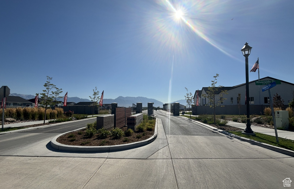 View of street with a residential view, sidewalks, and curbs