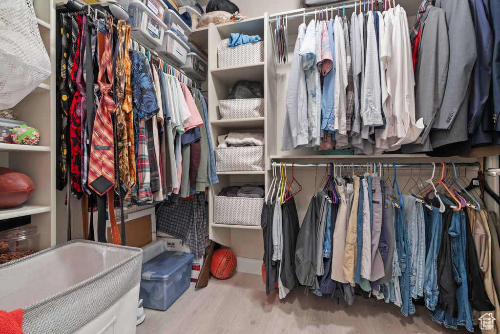 Spacious closet with wood finished floors