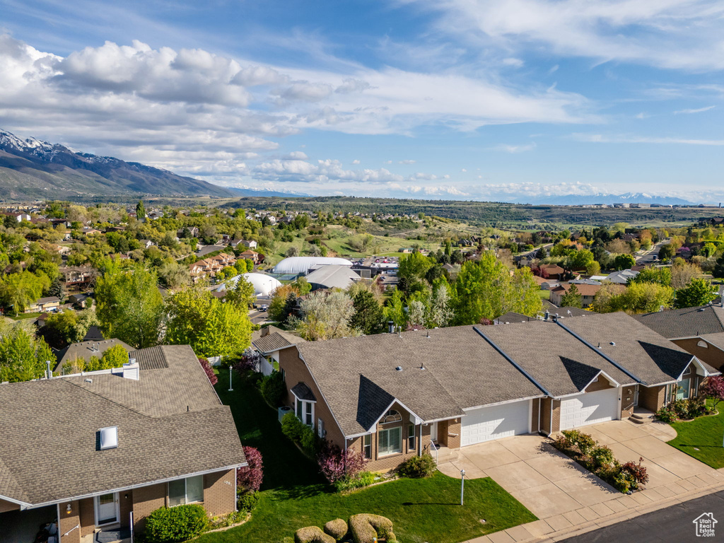 Birds eye view of property featuring a mountain view and a residential view