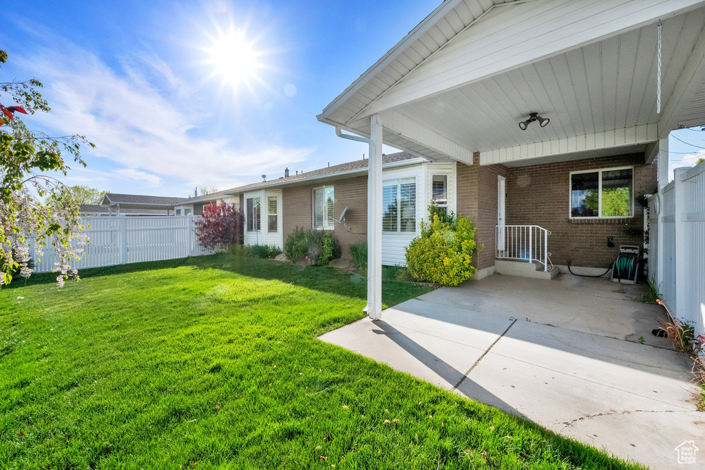 View of yard featuring fence