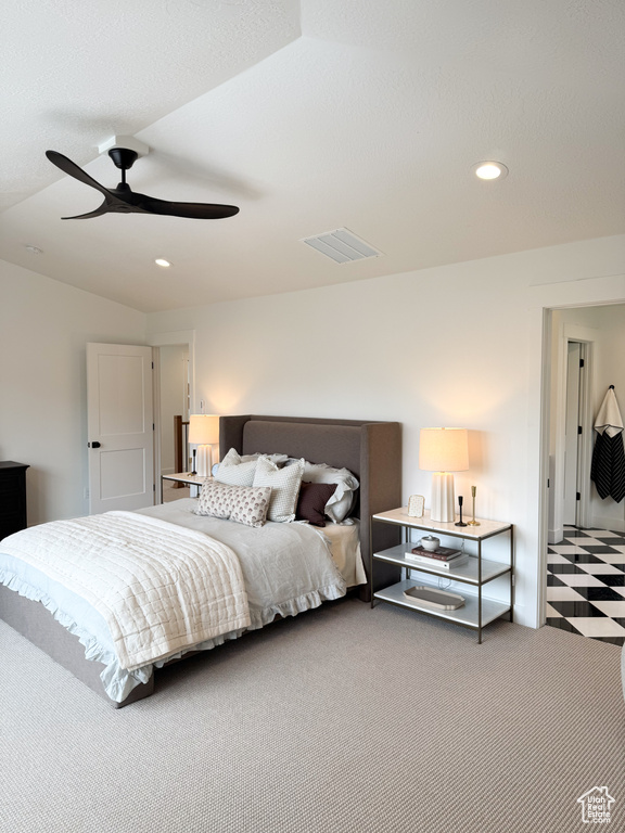 Carpeted bedroom featuring tile patterned floors, ceiling fan, recessed lighting, and visible vents