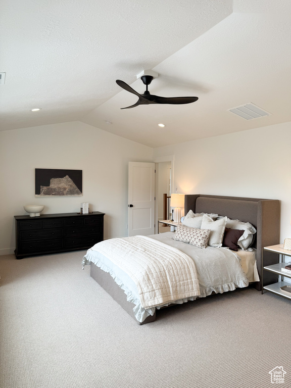 Carpeted bedroom featuring ceiling fan, lofted ceiling, recessed lighting, and visible vents