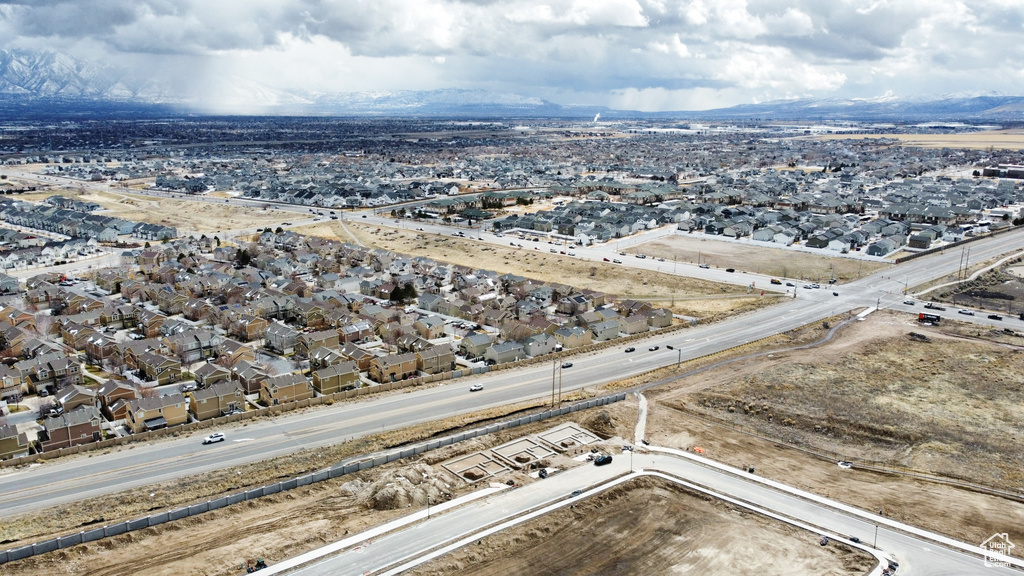 Drone / aerial view with a residential view and a mountain view