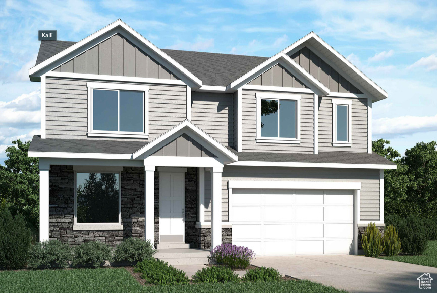 Craftsman house with board and batten siding, an attached garage, driveway, and stone siding