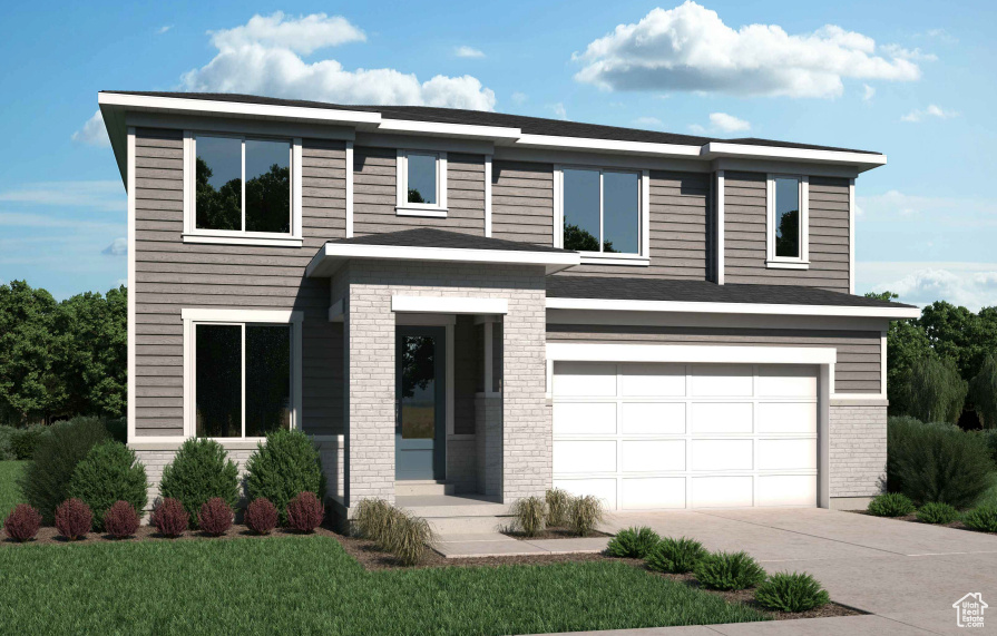 View of front facade featuring an attached garage, concrete driveway, brick siding, and a front yard