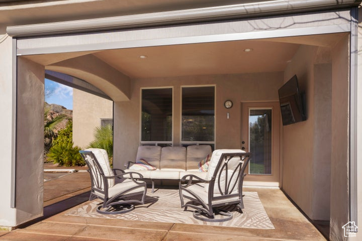 View of patio with an outdoor living space