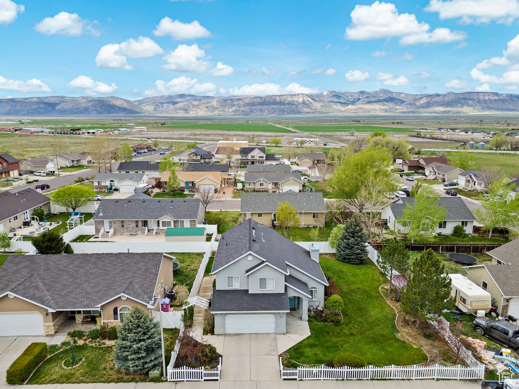 Drone / aerial view with a residential view and a mountain view