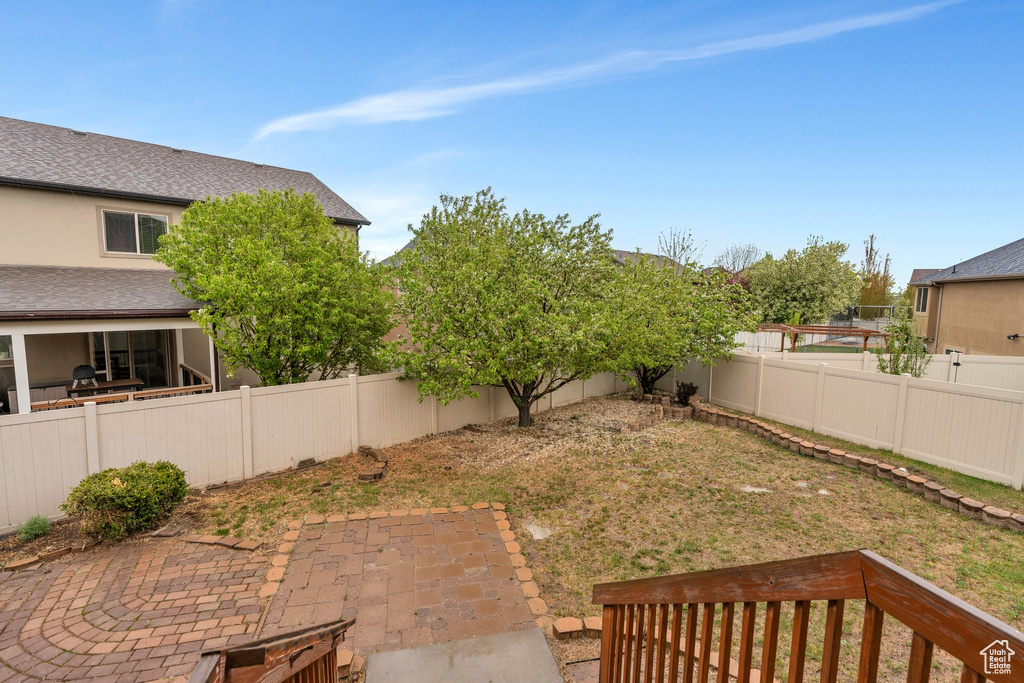 View of yard featuring a patio and a fenced backyard