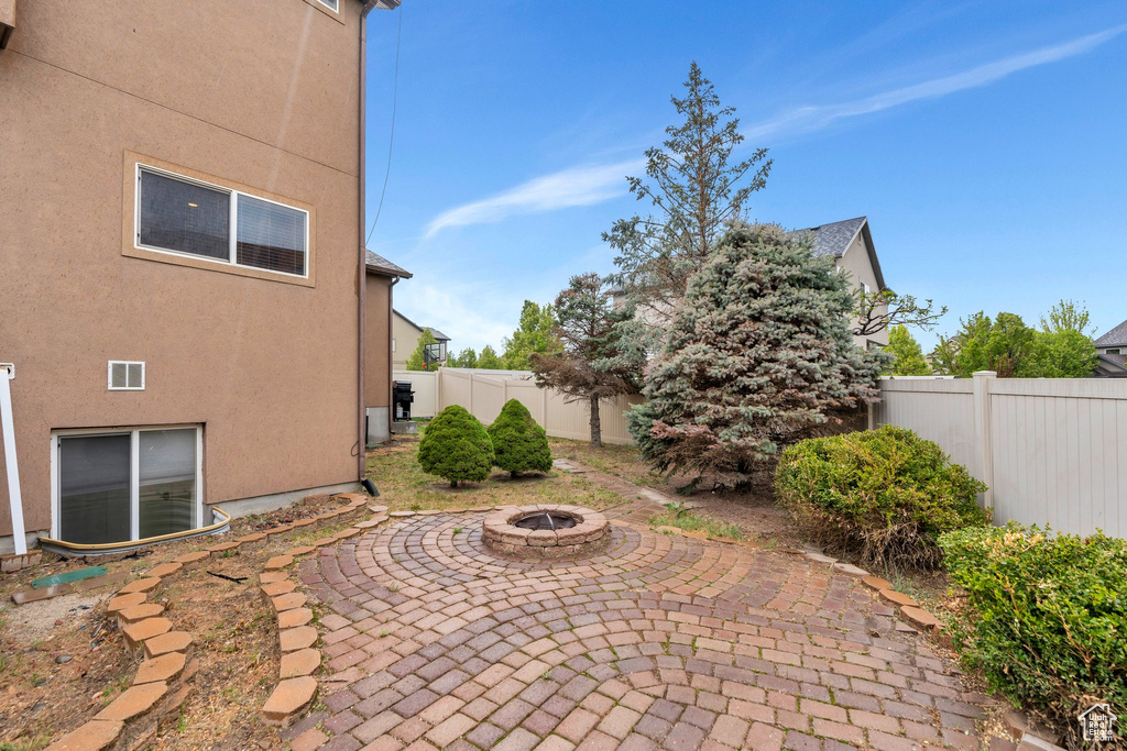 View of patio / terrace featuring a fire pit and a fenced backyard